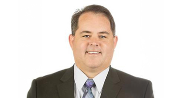 Headshot of Dan Mills