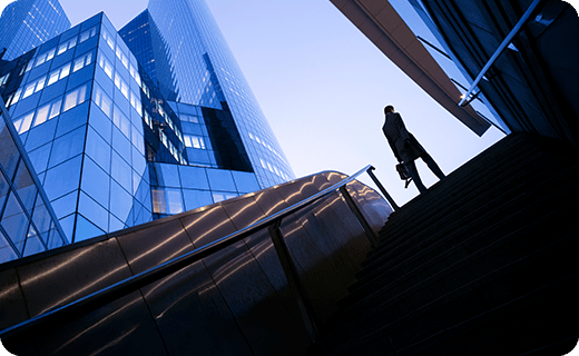 Businesswoman on top of stairs